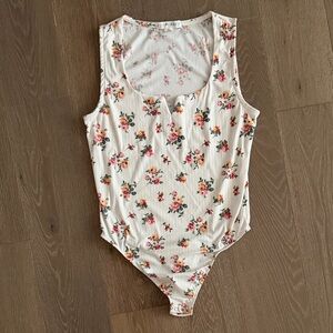 Women’s Eye Candy floral bodysuit. Size:XL. Gently Used.